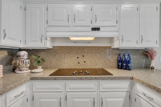 301 Brandywine Dr, Old Hickory, TN 37138 - kitchen featuring black electric stovetop, under cabinet range hood, white cabinets, and decorative backsplash