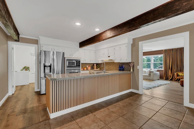 301 Brandywine Dr, Old Hickory, TN 37138 - kitchen featuring stainless steel appliances, a peninsula, recessed lighting, beamed ceiling, and backsplash