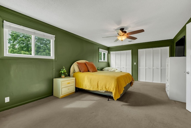 301 Brandywine Dr, Old Hickory, TN 37138 - bedroom with multiple closets, carpet, ornamental molding, and a ceiling fan