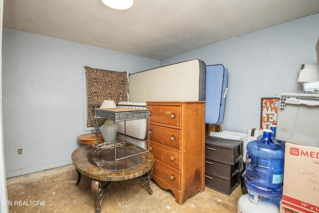 197 Wedgewood Ln, Spring City, TN 37381 - bedroom featuring unfinished concrete flooring and a textured ceiling