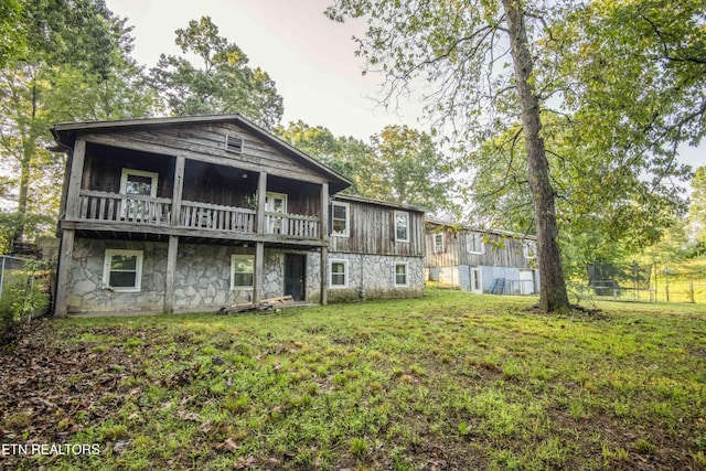 197 Wedgewood Ln, Spring City, TN 37381 - back of house featuring stone siding