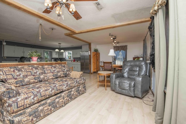 197 Wedgewood Ln, Spring City, TN 37381 - living room featuring a chandelier and light wood-style flooring