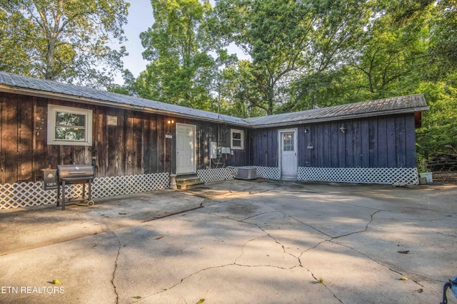 197 Wedgewood Ln, Spring City, TN 37381 - rear view of property with entry steps, a patio area, a metal roof, and driveway