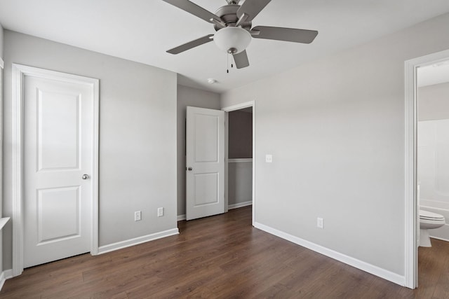 241 Tara Ct, Columbia, TN 38401 - unfurnished bedroom featuring dark wood-style flooring, connected bathroom, and a ceiling fan
