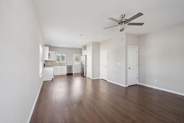 241 Tara Ct, Columbia, TN 38401 - unfurnished living room with dark wood-style flooring and a ceiling fan