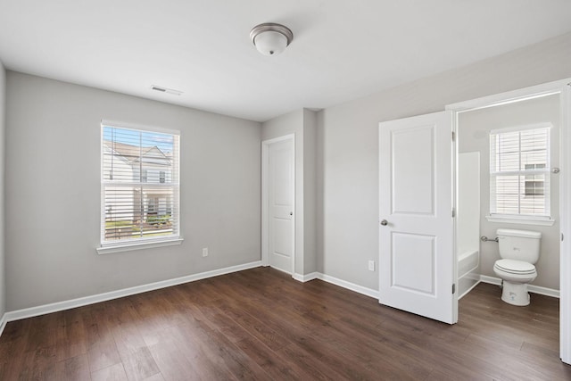 241 Tara Ct, Columbia, TN 38401 - unfurnished bedroom with dark wood finished floors and ensuite bathroom