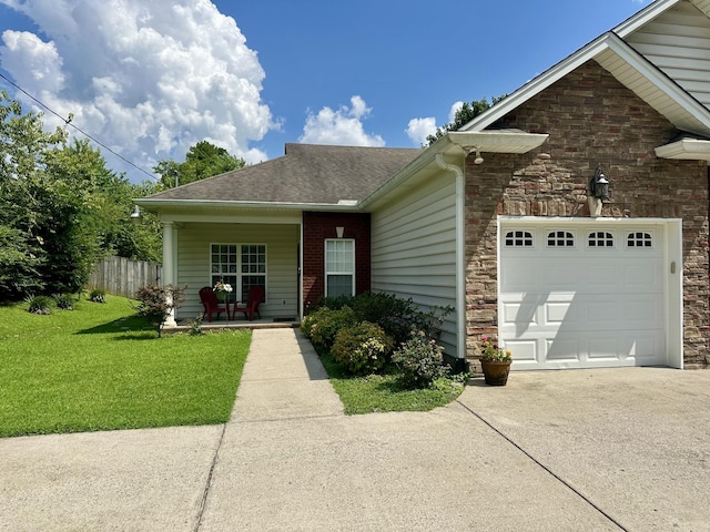 1609 Merritt St Unit A, Old Hickory, TN 37138 - view of front of house with concrete driveway, a garage, stone siding, roof with shingles, and a porch