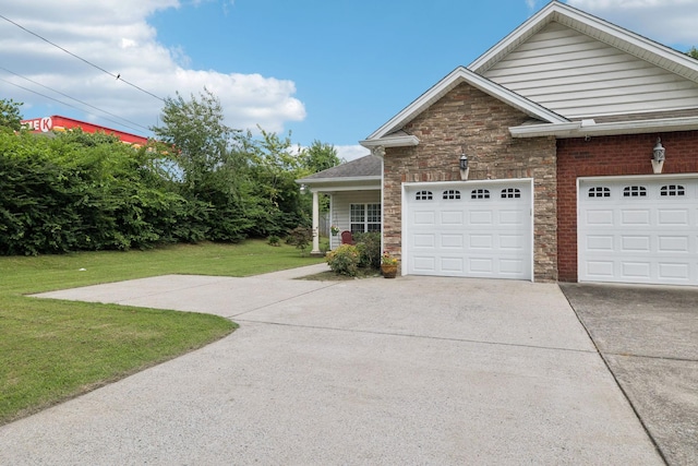 1609 Merritt St Unit A, Old Hickory, TN 37138 - view of front of home featuring stone siding, a front lawn, and driveway