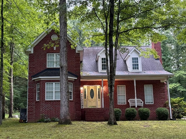 112 Hillwood Dr, Dickson, TN 37055 - view of front of property with a chimney, a front lawn, and brick siding