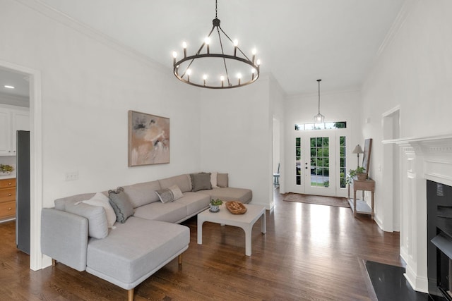 2785 Rutland Ct, Thompsons Station, TN 37179 - living area featuring a fireplace with flush hearth, crown molding, dark wood finished floors, a high ceiling, and a chandelier