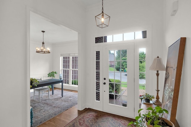 2785 Rutland Ct, Thompsons Station, TN 37179 - foyer with crown molding, a chandelier, and dark wood-type flooring