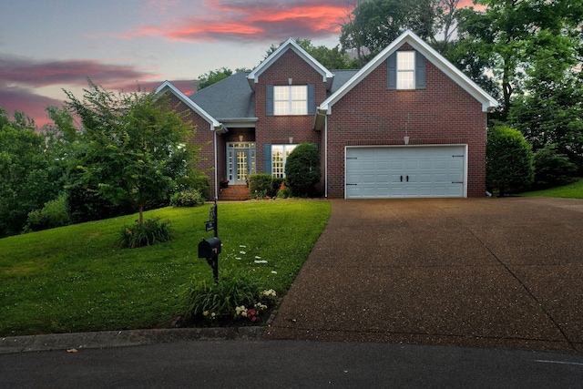 2785 Rutland Ct, Thompsons Station, TN 37179 - traditional-style home with concrete driveway, brick siding, an attached garage, and a front lawn