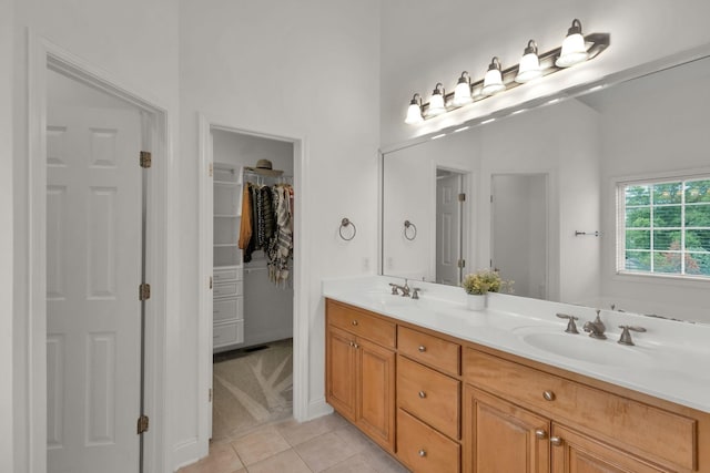 2785 Rutland Ct, Thompsons Station, TN 37179 - full bathroom with double vanity, tile patterned floors, and a spacious closet
