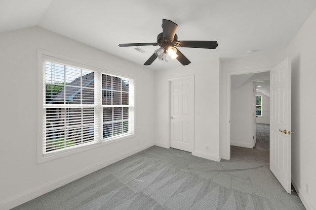 2785 Rutland Ct, Thompsons Station, TN 37179 - unfurnished bedroom with multiple windows, carpet, ceiling fan, and lofted ceiling