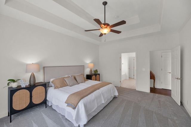 2785 Rutland Ct, Thompsons Station, TN 37179 - bedroom with a tray ceiling, carpet, ornamental molding, and a ceiling fan