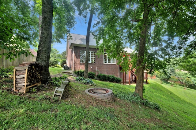 2785 Rutland Ct, Thompsons Station, TN 37179 - view of grassy yard featuring an outdoor fire pit