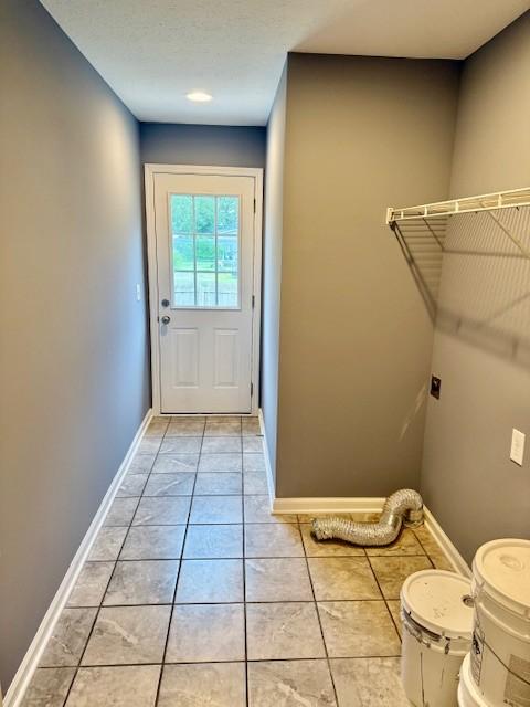 208 Broadrick St, Tullahoma, TN 37388 - entryway featuring light tile patterned floors and baseboards