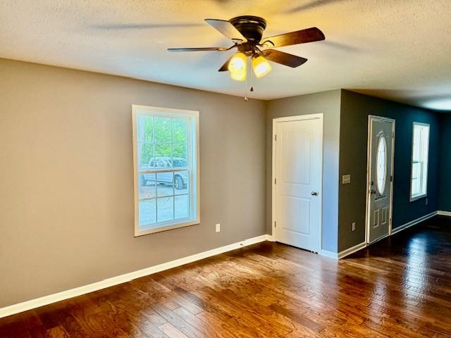 208 Broadrick St, Tullahoma, TN 37388 - spare room with wood finished floors, a textured ceiling, and a ceiling fan