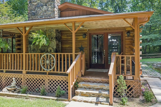 584 Mccord Hollow Rd, Hohenwald, TN 38462 - property entrance with log siding, board and batten siding, and stone siding