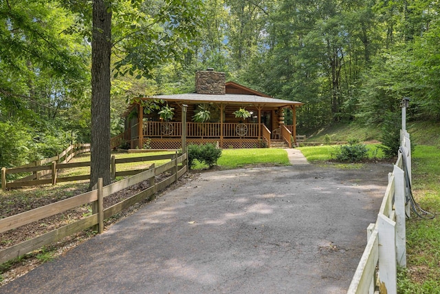584 Mccord Hollow Rd, Hohenwald, TN 38462 - covered porch with a wooded view