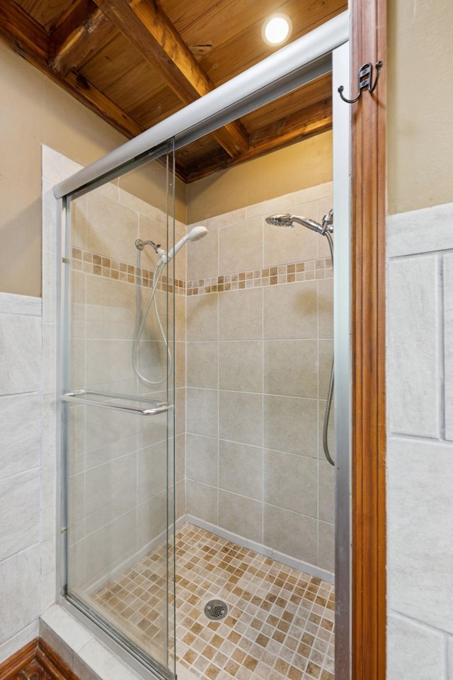 584 Mccord Hollow Rd, Hohenwald, TN 38462 - bathroom featuring a shower stall and a wooden ceiling with exposed beams