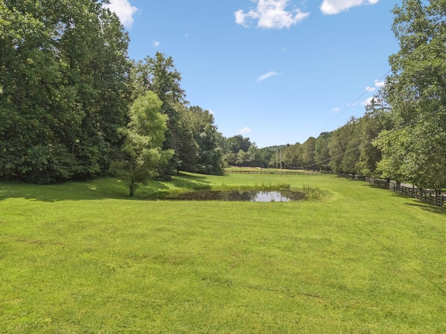 584 Mccord Hollow Rd, Hohenwald, TN 38462 - view of yard with a water view and a forest view