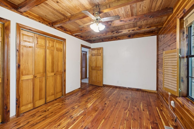 584 Mccord Hollow Rd, Hohenwald, TN 38462 - unfurnished bedroom with dark wood-style flooring, a wooden ceiling with exposed beams, ceiling fan, and multiple windows