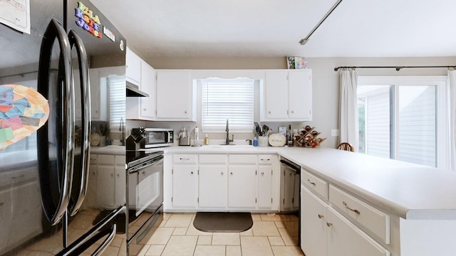 2806 Holsted Dr, Murfreesboro, TN 37128 - kitchen with black appliances, a peninsula, light countertops, and white cabinets