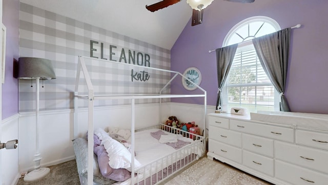 2806 Holsted Dr, Murfreesboro, TN 37128 - bedroom with a wainscoted wall, vaulted ceiling, a ceiling fan, and light carpet