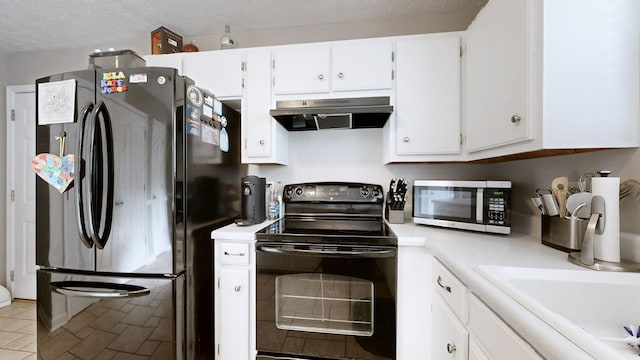 2806 Holsted Dr, Murfreesboro, TN 37128 - kitchen with freestanding refrigerator, black / electric stove, stainless steel microwave, exhaust hood, and light countertops