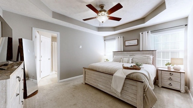 2806 Holsted Dr, Murfreesboro, TN 37128 - bedroom featuring light colored carpet, a raised ceiling, a ceiling fan, and ensuite bath