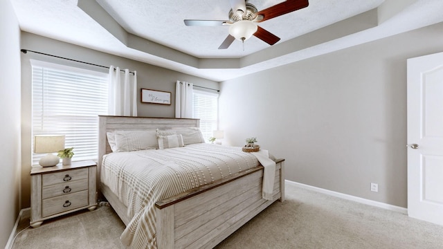 2806 Holsted Dr, Murfreesboro, TN 37128 - bedroom with light carpet, a tray ceiling, and ceiling fan