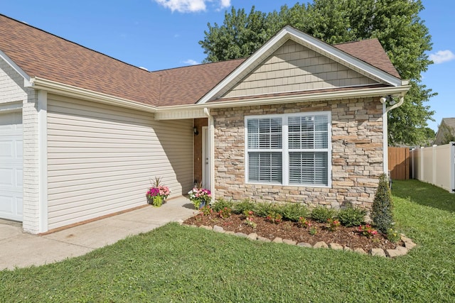 2016 Golden Ct, Spring Hill, TN 37174 - ranch-style house featuring a garage, stone siding, and roof with shingles