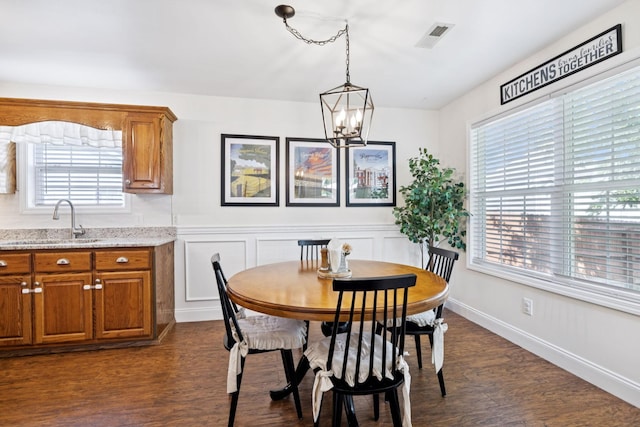 2016 Golden Ct, Spring Hill, TN 37174 - dining room featuring a chandelier, dark wood-style floors, and wainscoting