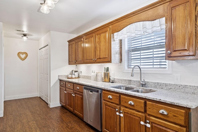2016 Golden Ct, Spring Hill, TN 37174 - kitchen featuring dishwasher, brown cabinetry, dark wood-type flooring, light stone countertops, and backsplash