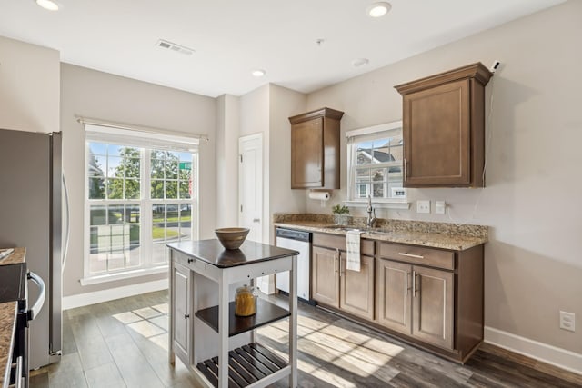 401 Birr Dr, Spring Hill, TN 37174 - kitchen with appliances with stainless steel finishes, plenty of natural light, wood finished floors, light stone counters, and recessed lighting