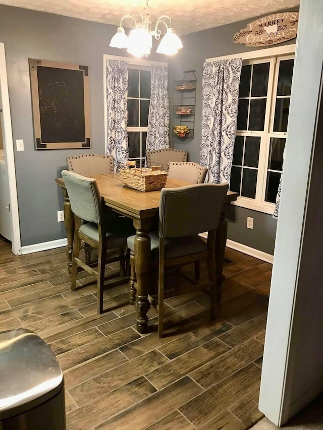 217 Red Oak Rd, Dover, TN 37058 - dining room featuring wood tiled floors and a chandelier