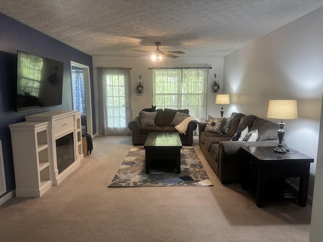 217 Red Oak Rd, Dover, TN 37058 - carpeted living area featuring a textured ceiling and a ceiling fan