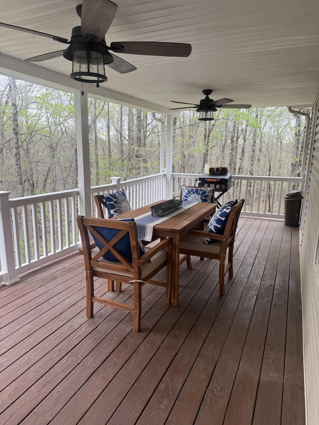 217 Red Oak Rd, Dover, TN 37058 - wooden deck with outdoor dining space and a ceiling fan