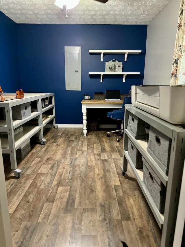 217 Red Oak Rd, Dover, TN 37058 - office area with electric panel, wood-type flooring, and a textured ceiling