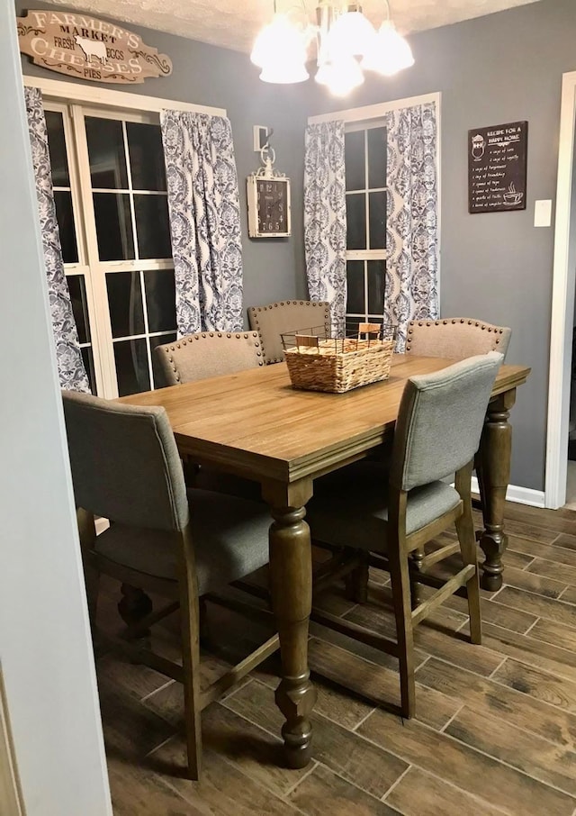217 Red Oak Rd, Dover, TN 37058 - dining space with wood tiled floors and a chandelier