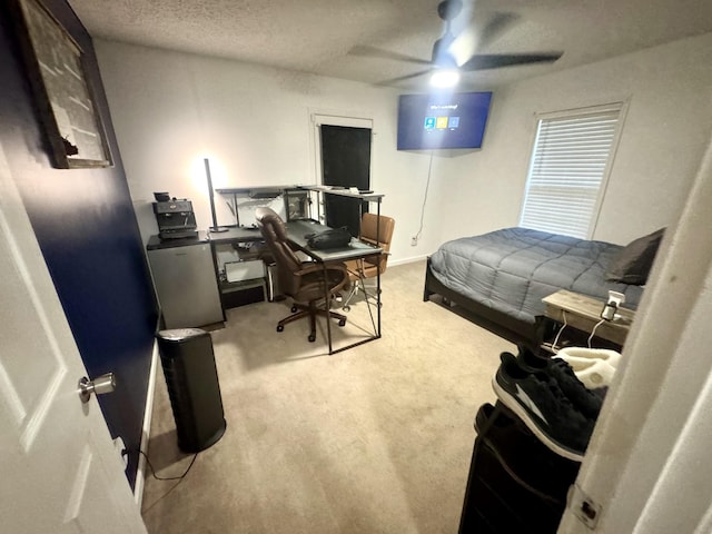 217 Red Oak Rd, Dover, TN 37058 - carpeted bedroom with an office area, a textured ceiling, and ceiling fan