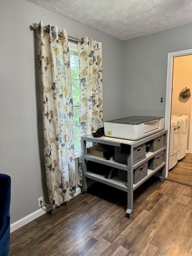 217 Red Oak Rd, Dover, TN 37058 - detailed view of wood finished floors, washer and clothes dryer, and a textured ceiling