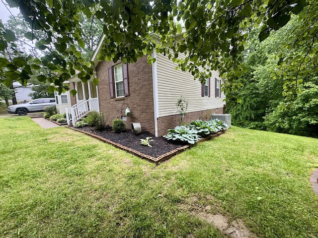 217 Red Oak Rd, Dover, TN 37058 - view of home's exterior with a yard and brick siding