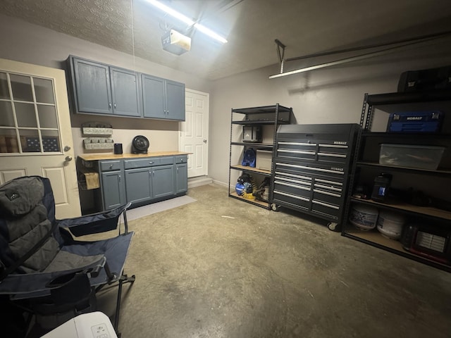 217 Red Oak Rd, Dover, TN 37058 - garage with a garage door opener and baseboards
