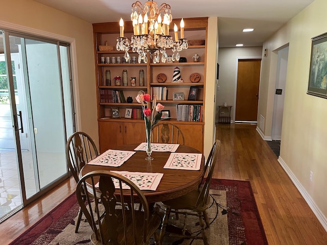 499 Pettus St, Lawrenceburg, TN 38464 - dining area featuring wood finished floors and a chandelier