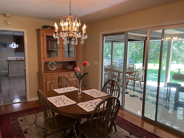 499 Pettus St, Lawrenceburg, TN 38464 - dining area featuring a chandelier and wood finished floors