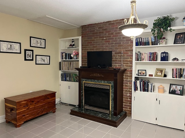499 Pettus St, Lawrenceburg, TN 38464 - tiled living room featuring attic access and a fireplace