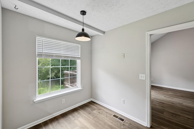7616 Hudlow Ct, Fairview, TN 37062 - empty room featuring wood finished floors and a textured ceiling