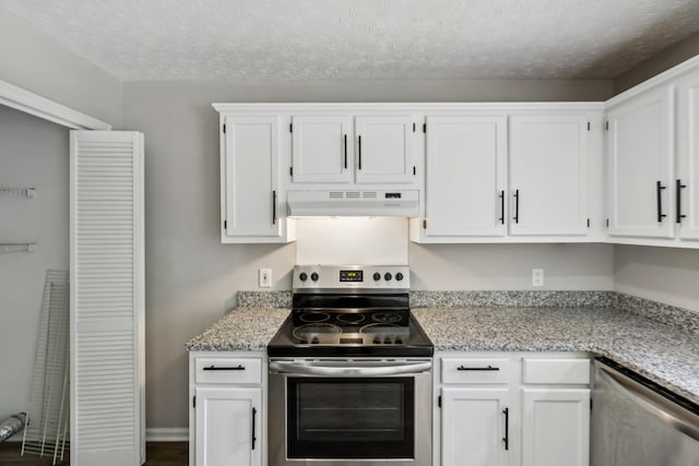 7616 Hudlow Ct, Fairview, TN 37062 - kitchen featuring under cabinet range hood, appliances with stainless steel finishes, white cabinetry, and a textured ceiling